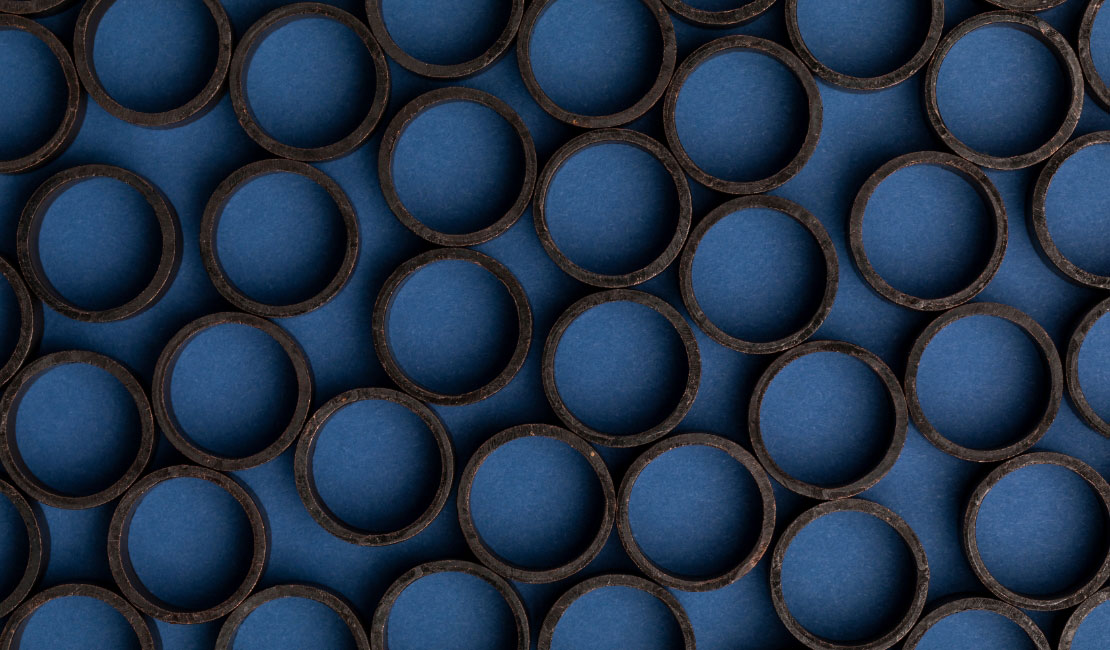 Stacked cut ends of blue pipe